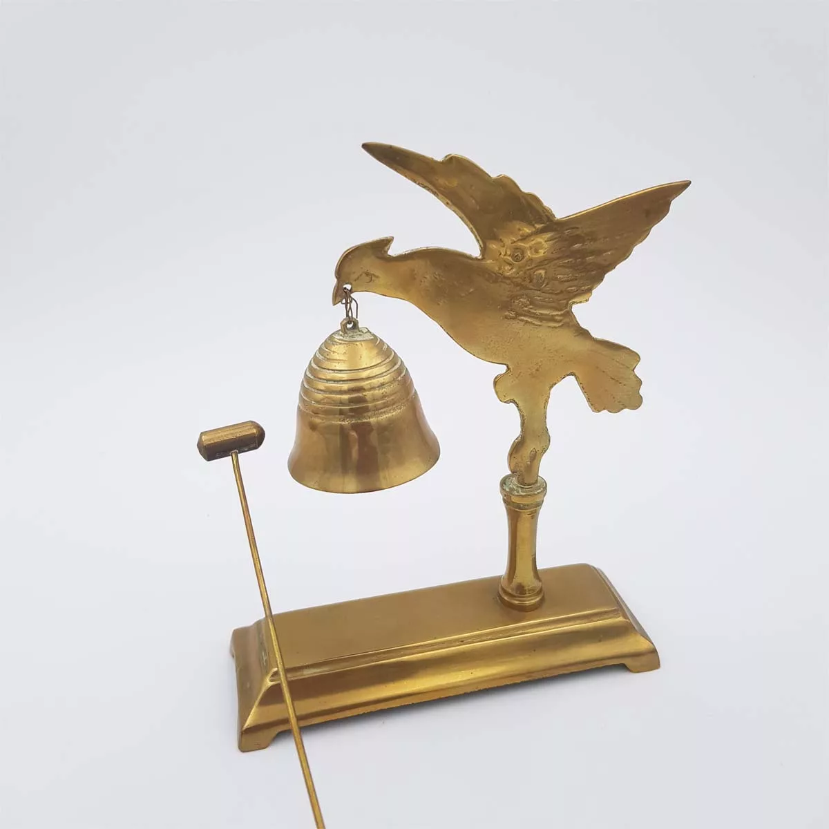 Brass chimes and mallet table bell decoration of a bird