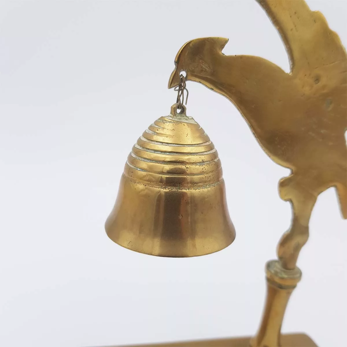 Brass chimes and mallet table bell decoration of a bird