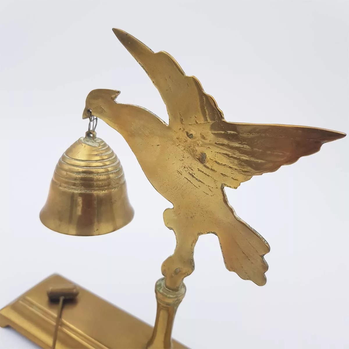 Brass chimes and mallet table bell decoration of a bird