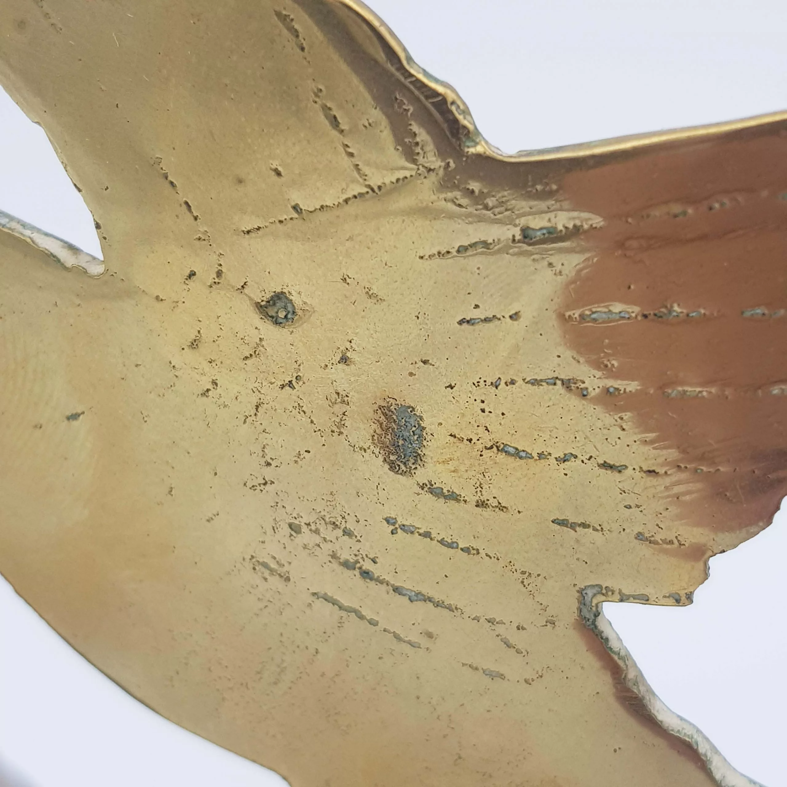 Brass chimes and mallet table bell decoration of a bird