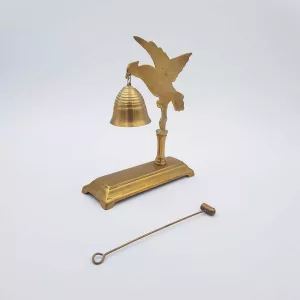 Brass chimes and mallet table bell decoration of a bird