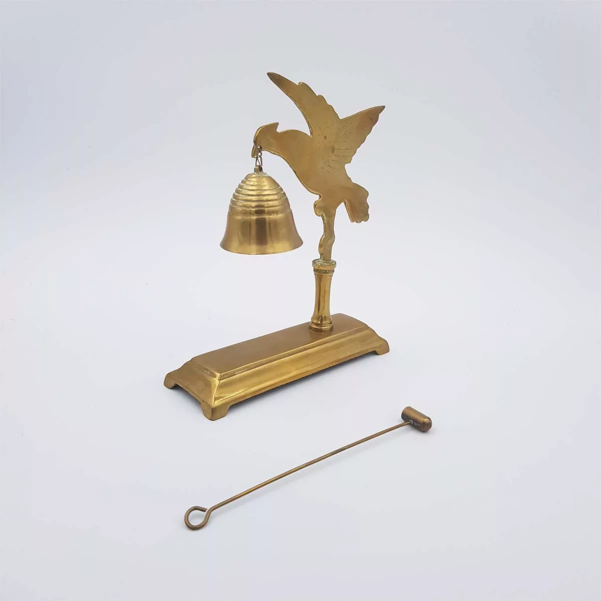 Brass chimes and mallet table bell decoration of a bird