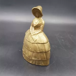 Brass table bell woman in hat and dress France vintage