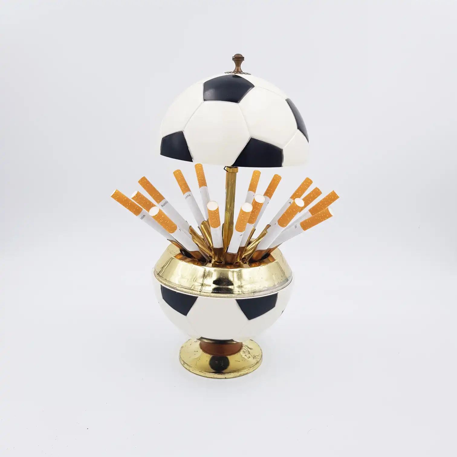 Vintage cigarettes dispenser cigarettes box in the shape of a soccer ball