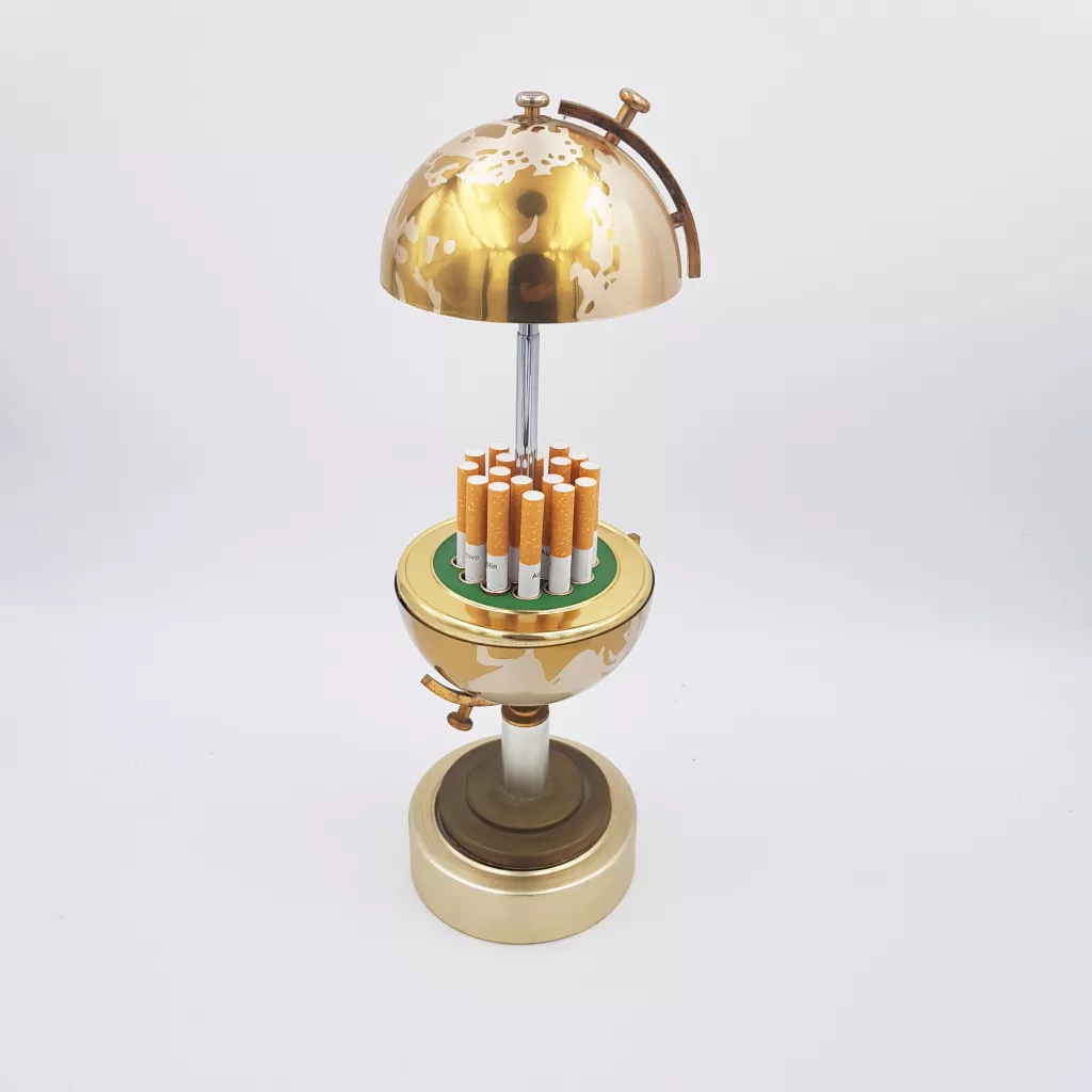 Vintage cigarettes dispenser shape of a small earth globe