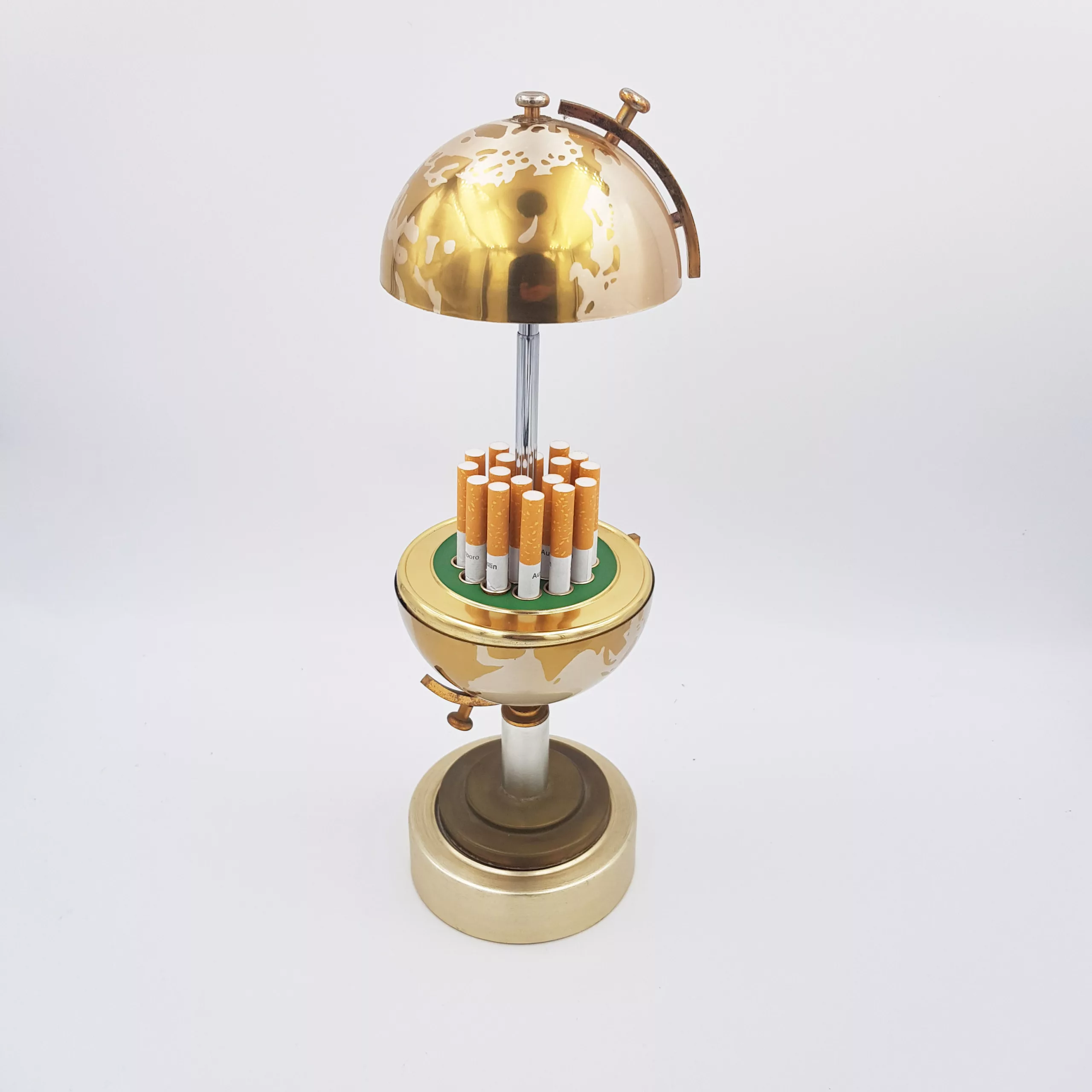 Vintage cigarettes dispenser shape of a small earth globe