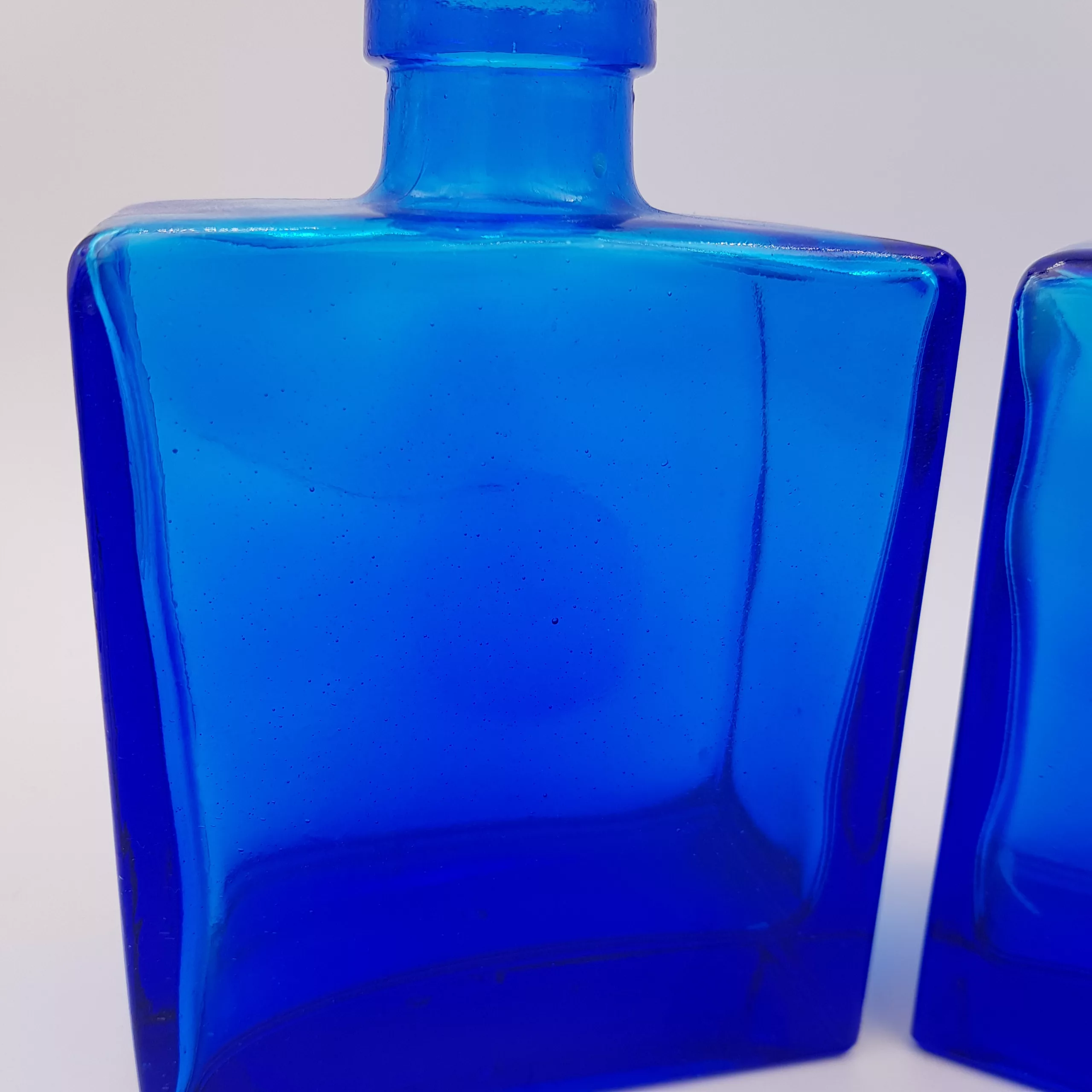 2 vintage cobalt blue glass flasks