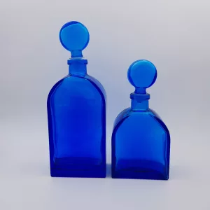 2 vintage cobalt blue glass flasks round shoulders