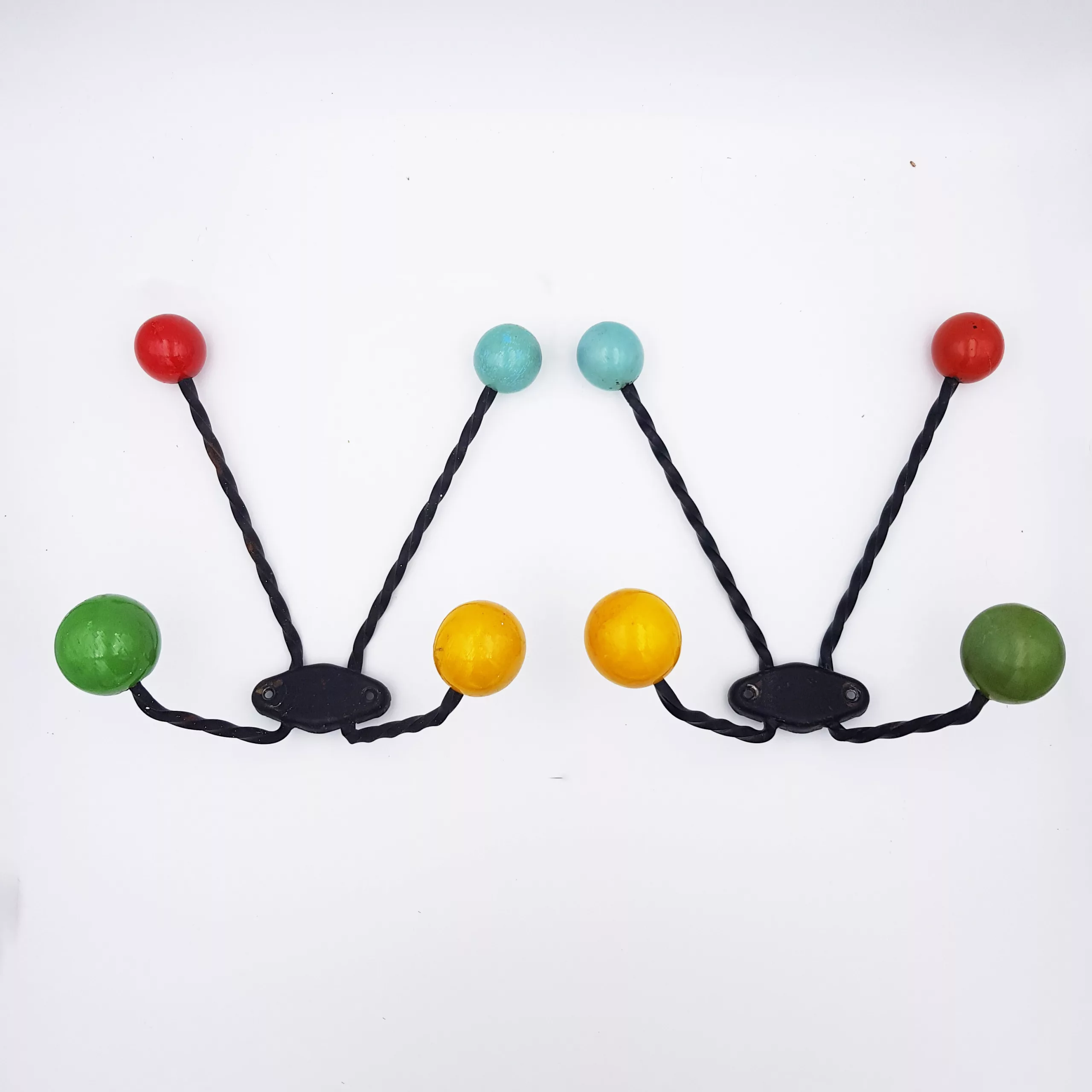 Pair of vintage coat racks twisted metal colored wooden balls