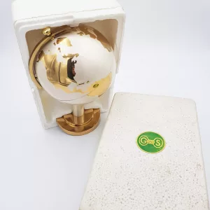 Vintage brass cigarettes dispenser shape of an earth globe