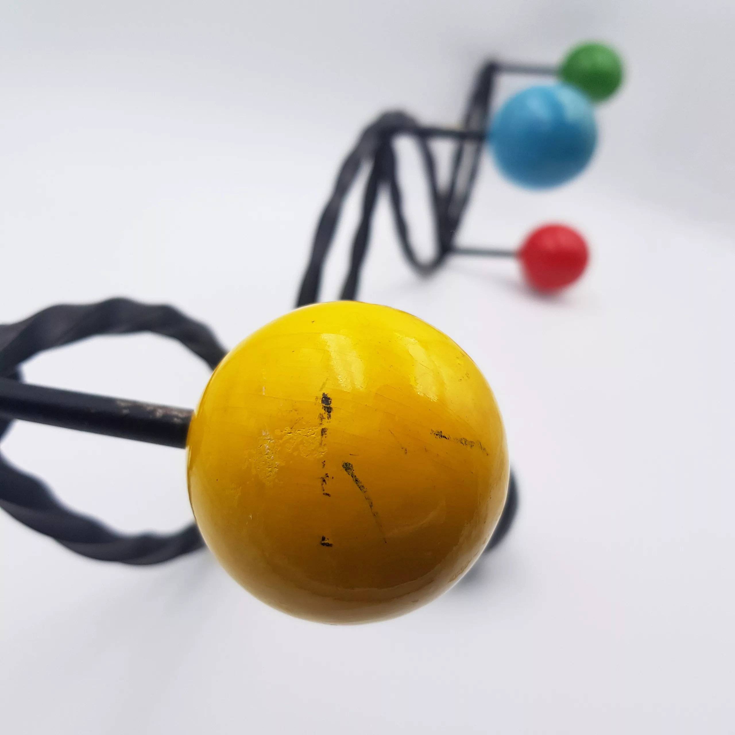 Vintage coat rack twisted metal colored wood balls