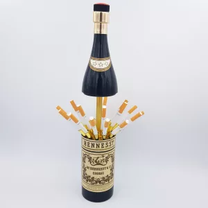 Vintage cigarettes dispenser shape of a bottle of cognac Hennessy musical box