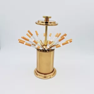 Vintage cigarettes dispenser shape of a gold cylinder